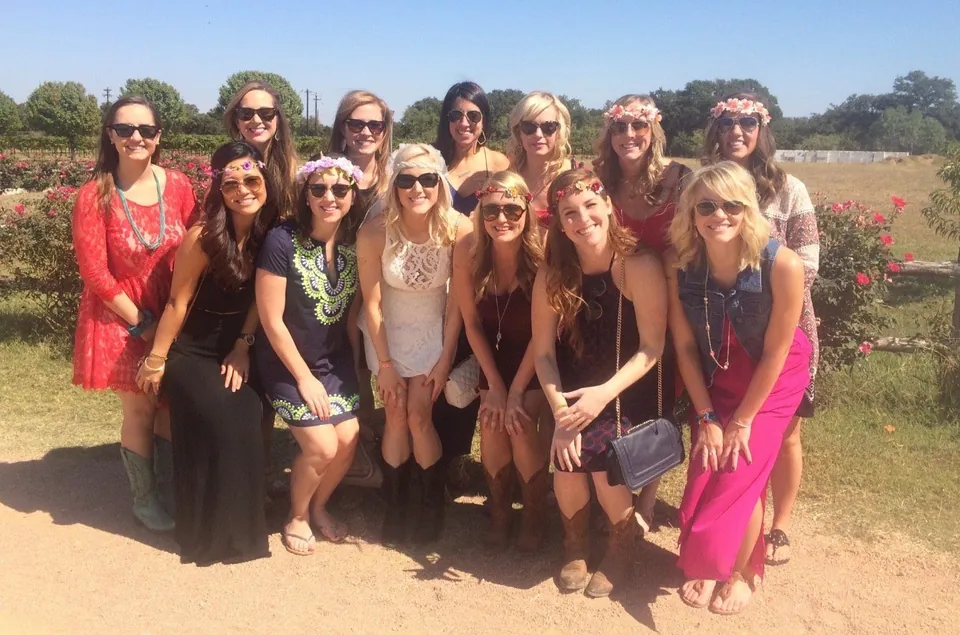 A group of guests posing together on a Long Horn Wine Tours day out.